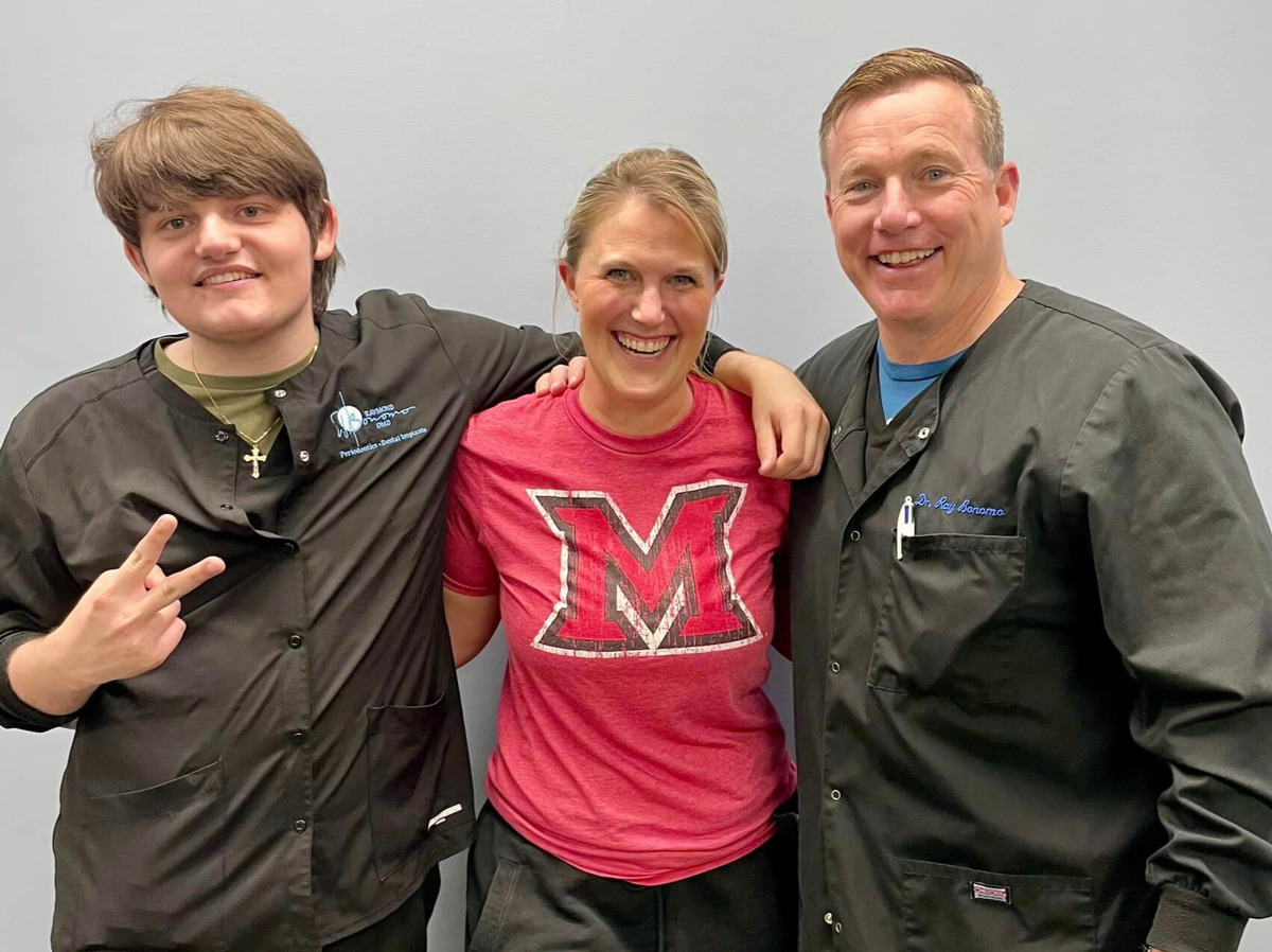 Dr. Bonomo and Staff smiling