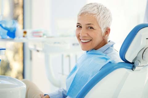 Woman sitting in dental chair